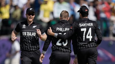 New Zealand's Glenn Phillips, centre, celebrates with teammates after the dismissal of Australia's Travis Head. AP