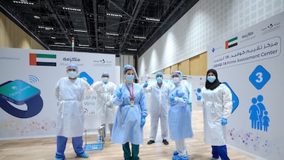 Doctors, nurses and volunteers take time out for a photograph at the new Covid-19 Prime Assessment Center at Adnec. More than 500 were shortlisted following a thorough selection process, with each doctor appraised based on their qualifications, performance and reputation. Victor Besa / The National