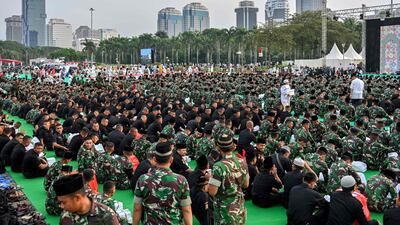 Police and military personnel break fast with Indonesia's President Joko Widodo in Jakarta. AFP