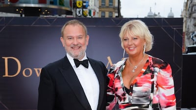 Hugh Bonneville and wife Lulu Williams arrive for the 'Downton Abbey' film world premiere in London on September 9, 2019. Getty Images
