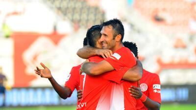 Ali Mabkhout (left) and Mirko Vucinic celebrate Al Jazira's second goal in their victory over Sharjah. Mutawakil Mubarak / Al Ittihad