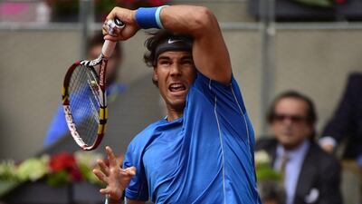 Rafael Nadal returns the ball to Argentinian Juan Monaco during their men's singles match at the Madrid Masters second round at the Caja Magica in Madrid on Wednesday. Pierre-Philippe Marcou / AFP / May 7, 2014
