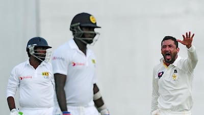 Junaid Khan, right, took four Sri Lanka wickets at Colombo on Thursday. Lakruwan Wanniarachchi / AFP
