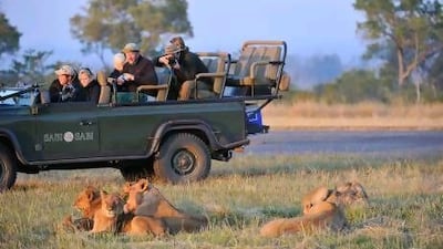 From left: Sunil Sawlani, Mooda Shabani and Benny Jacob compete at the Arab Forex Championship in Dubai last week. Razan Alzayani / The National
