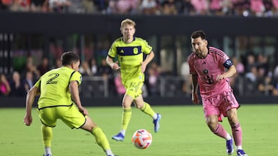 Inter Miami's Argentine forward Lionel Messi fights for the ball with Nashville's US defender Daniel Lovitz. AFP