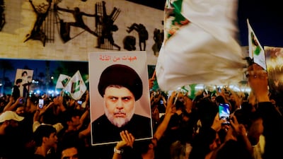 Supporters of Shiite cleric Moqtada Al Sadr celebrate the announcement of the results of the parliamentary elections in Tahrir Square, Baghdad. AP