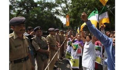Advocates of a proposed new Indian state, Gorkhaland, demonstrate Saturday in New Delhi. A reader notes that the birth of Telangana may generate many more demands, like this one, to divide existing states. Altaf Qadri / AP