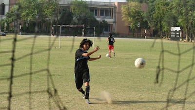 Pakistani national cricket and football player Diana Baig takes part in a football training session at a ground in Lahore in May. Arif Ali / AFP / May 4, 2016