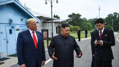 US President Donald Trump stands with North Korean leader Kim Jong-un at the demilitarised zone separating the two Koreas, in Panmunjom, South Korea. AFP