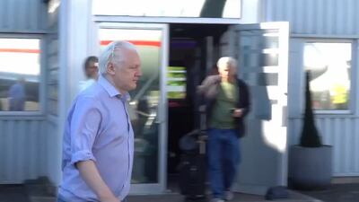 WikiLeaks founder Julian Assange heads to board a plane at Stansted Airport, in Essex. EPA