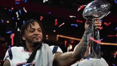 Patrick Chung of the Patriots holds the Super Bowl trophy. AFP