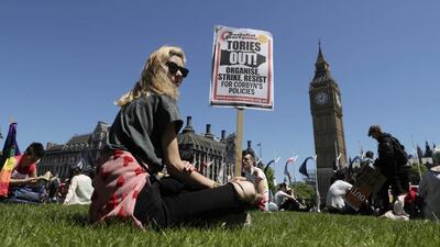 People demonstrate in Parliament Square against the possible Conservative and DUP (Democratic Unionist Party) coalition government following the Britain's general election result, in London, Saturday June 10, 2017. (AP Photo/Tim Ireland)