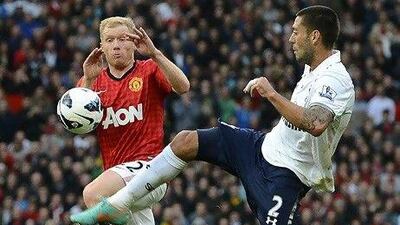 Manchester United's Paul Scholes, left, had a game of two halves against Tottenham Hotspur.