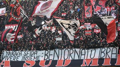 AC Milan supporters display a banner reading "Welcome back Ibra". AFP