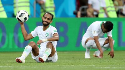Saudi Arabian players look dejected after the match. REUTERS/Marko Djurica