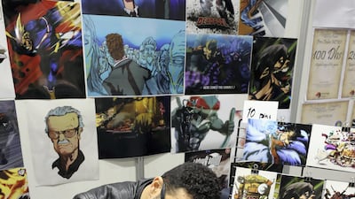 Dubai, United Arab Emirates - April 11, 2019: Artist Andrew Henry draws a portrait at the Middle East Film and Comic Con. Thursday the 11th of April 2019. World Trade Centre, Dubai. Chris Whiteoak / The National