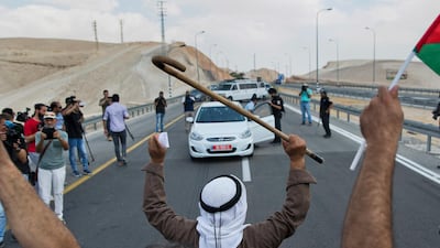 Protesters block the traffic on the highway passing near the West Bank Bedouin community of Khan Al Ahmar. AP