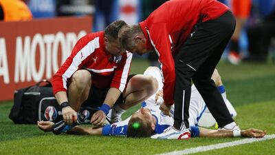 Slovakia’s Peter Pekarik lies injured and receives medical treatment. Jason Cairnduff / Reuters