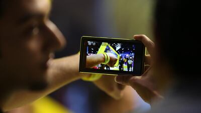 A visitor tries out the Lumia 1020 during the Gitex Shopper event in Dubai. Pawan Singh / The National
