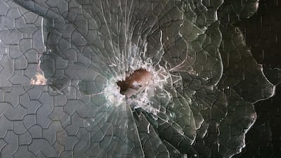 A shrapnel hole in a glass at the site of a rocket attack at a residential house in Kabul, Afghanistan December 12, 2020. EPA