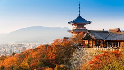 Japan, Honshu, Kansai region, Kiyomizu-Dera, this ancient temple was first built in 798 and the present buildings date from 1633 (view of the temple and city of Kyoto in the background - elevated view). Getty Images