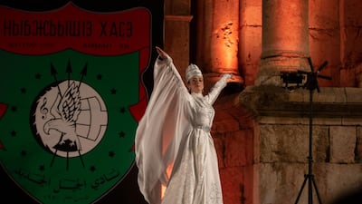 A Circassian dancer from Al-Jeel Al-Jadeed Club (the New Generation Club) performs during the 2019 Jerash Festival of Culture and Arts at the Jerash archeological site, Jerash, some 46 km North of Amman, Jordan. EPA