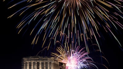 Fireworks explode over the ancient Parthenon temple on top of the Acropolis hill during New Year's Day celebrations, in Athens on January 1, 2023. Reuters
