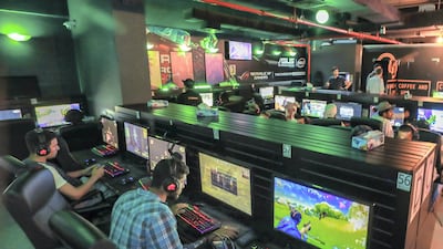 Gamers in action at Gee Gees Gaming café in Abu Dhabi. The National