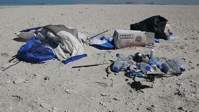Trash is left behind by visitors of the man made island next to Bahraini Island.