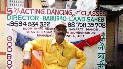 Baburao Ladsaheb teaches acting dancing fighting and modeling in his one-room flat in a Mumbai slum.