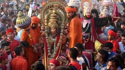 Hindu devotees, dressed up as deities, take part in a religious procession on the grounds of the Durgiana Temple in Amritsar. AFP
