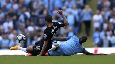 Manchester City's Yaya Toure, right, challenges Hull City's Evandro Goebel on April 8, 2017. Dave Thompson / Press Association