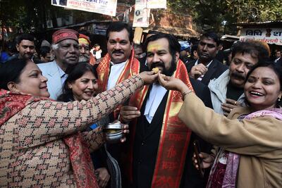 Hindu devotees offer sweets to lawyer Vishnu Shankar Jain after Varanasi district court ruled they be allowed to pray in the cellar of the Gyanvapi Mosque. EPA