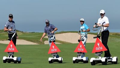 Henrik Stenson of Sweden, Jordan Spieth of the United States, Jordan Spieth of the United States and Rory McIlroy of Northern Ireland pictured riding a ‘Golfboard’ during a photocall at Saadiyat Beach Golf Club before the Abu Dhabi HSBC Golf Championship on January 19, 2016 in Abu Dhabi, United Arab Emirates. Kinnaird/Getty Images