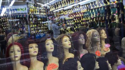 Wigs are sold in a shop on Atlantic Road. Dan Kitwood / Getty