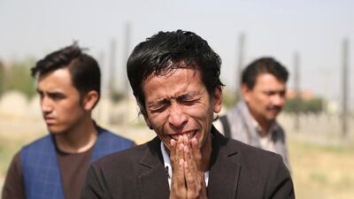 Relatives mourn a victim after Wednesday's deadly suicide bombing. AP