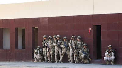 Kuwaiti and British soldiers take part in the Exercise Desert Warrior, attended by Prince William, Duke of Cambridge (unseen), at Sheikh Salem al-Ali al-Sabah Camp, about 40 kilometres north of Kuwait City. AFP