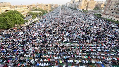 Muslim devotees pray on the first day of Eid Al Fitr in the Heliopolis neighbourhood in Cairo, Egypt. AFP