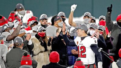 Buccaneers quarterback Tom Brady celebrates with his teammates after beating the Packers at Lambeau Field. USA TODAY Sports