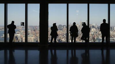 Members of the media look north at the Manhattan skyline from the 64th floor of the One World Trade Center. Below the tower will be 55,000 square feet of retail space and connections to 11 subways and trains. Mike Segar / Reuters