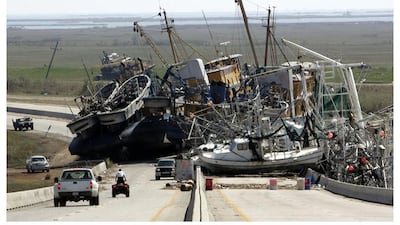 Fshing boats blocks Highway 23 in Empire, La. after Hurricane Katrina ravaged the region, and the same site a decade later.