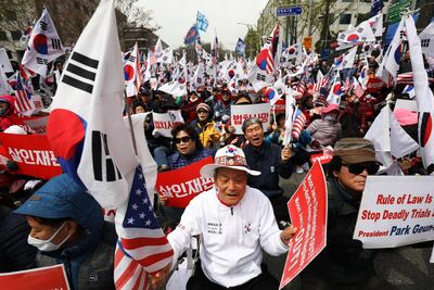 Supporters of Park Geun-hye protest outside the Seoul Central District Court on April 6, 2018 as the former South Korean president was found guilty of crimes ranging from coercion to abuse of power and the leaking of state secrets. SeongJoon Cho / Bloomberg