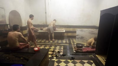 Syrian men visiting the Al Malik Al Zahir Hammam in the capital Damascus on January 7, 2017 as an ongoing water crisis continues due to the fighting between government forces and rebel fighters. Louai Beshara / AFP
