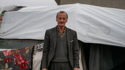 Jindires resident Haidar Sido, 62, in front of the tent where his family now live. He said many people are living in similar circumstances, without receiving any real assistance