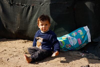 A child takes shelter in a tent camp in Rafah in southern Gaza. Reuters