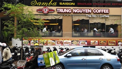 Customers sit inside a Trung Nguyen Coffee outlet in Ho Chi Minh City, Vietnam. Munshi Ahmed / Bloomberg