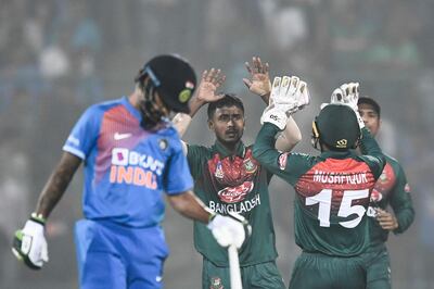 Bangladesh's Aminul Islam, centre, celebrates the dismissing India's Shreyas Iyer. AFP