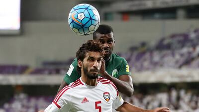 UAE's Tariq Ahmed, front, shields the ball from Saudi Arabia's Mansour Al Harbi. Chris Whiteoak / The National