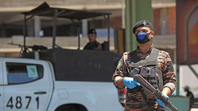 Iraqi security forces stand guard at a checkpoint in Baghdad. AFP