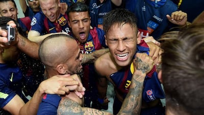 Neymar of Barcelona celebrates scoring his team’s third goal with team mates during the UEFA Champions League Final between Juventus and FC Barcelona at Olympiastadion on June 6, 2015 in Berlin, Germany. on June 6, 2015 in Berlin, Germany. (Photo by Matthias Hangst/Getty Images)